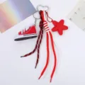Vibrant red mini canvas shoe keychain with star charm and woven mountaineering rope - Red