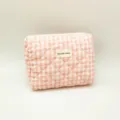 Close-up of pink gingham quilted cosmetic bag with diamond pattern and fabric label - 24*20*6cm / Pink White