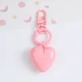 Detailed view of a candy-colored resin heart keychain pendant for bags and car keys - Pink