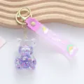 Cute purple liquid sand bear keychain with glittering star sequins and purple wrist strap - Teddy Bear / Purple