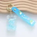 Adorable light blue oil-filled quicksand bear keychain with star sequins and wish strap - Teddy Bear / Blue