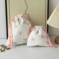 Two sweet pink bow drawstring storage bags in different sizes for home organization - Pink