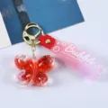 Roter Glitzer Acryl Schmetterling Schlüsselanhänger mit rosa Bubble Handschlaufe - Rot