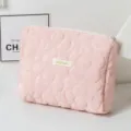 Close-up of a pink quilted cosmetic bag featuring a stylish large floral pattern design - 24*20*6cm / Pink