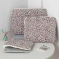 Three sizes of quilted floral laptop and tablet sleeves with metal ring zippers. - 11" / Red Floral