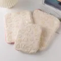 Close-up view of three beige plush heart-patterned laptop sleeves for iPad and Pro - 11 Inch / Beige Sherpa Heart