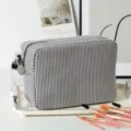Seersucker striped cosmetic bag displayed with professional makeup brushes on a tray - 22*9*15cm / Black & White Stripes
