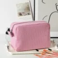 Detailed view of large pink striped seersucker cosmetic bag with professional makeup brushes. - 22*9*15cm / Pink White