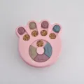 Pink paw-shaped dog puzzle feeder toy for slow eating and mental stimulation - Paw Print Puzzle Toy / Pink