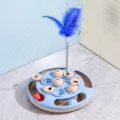 Interactive light blue slow feeder cat turntable toy with spring-mounted feather and balls - Ping Pong Treat Puzzle Toy / Blue