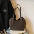 Elegant brown soft leather tote bag for women featuring large capacity and buckle straps - Single Bag / Coffee