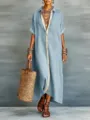 Detailed view of the light blue cotton-linen shirt dress with contrast placket and straw bag. - S / Sky Blue