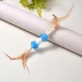 Gioco per gatti fatto a mano con piume naturali e bozzolo di seta per la caccia - Lunghezza totale 30 cm / Blu