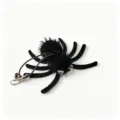 Macro view of plush Halloween spider cat toy with elastic cord and metal clip attachment - 6.7x6.3cm / Bell with Hook