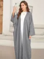 Detail view of the elegant grey batwing sleeve cardigan featuring delicate moon embroidery. - S / Robe / Gray