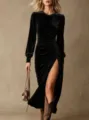 Detailed view of women's black long sleeve velvet dress with high slit and elegant waist. - S / Black