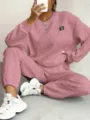 Pink knit textured pullover and trousers lounge set detail showing the fabric and design. - Pink with Label