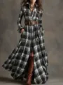 Detailed view of women's black and white plaid long sleeve shirt dress with chic belt styling. - S / Dresses / Black