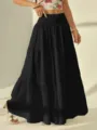 Vista detallada de la elegante falda larga negra con cintura alta y volantes finos. - S / Negro