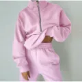 Pink fleece half zip sweatshirt and sweatpants set detail showcasing soft fabric and cozy casual style. - Pink