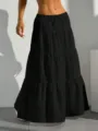 Detail view of the black tiered maxi skirt featuring a comfy drawstring waist and flared hem. - S / Black