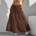 Detailed shot of a brown tiered maxi skirt with elastic waist and delicate textured fabric. - S / Coffee