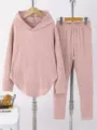 Detail view of women solid color casual hoodie and pants lounge set in pink texture. - S / Top And Bottom / Lotus Pink