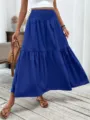 Detail view of the blue tiered maxi skirt, featuring high waist shirring and elegant drape. - Sapphire Blue