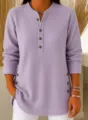Detailed view of women's purple V-neck long sleeve top showing button collar texture. - S / Purple
