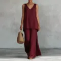 Detailed view of the elegant burgundy sleeveless v-neck top and wide leg pants matching set. - Burgundy