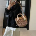 Bohemian straw woven bucket bag with pink 'hello' embroidery and floral scarf handle - Pink