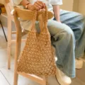 Natural beige macrame woven tote bag with braided handles for summer beach vacations - Brown