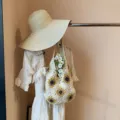 Handmade crochet sunflower shoulder bag crafted with woven cotton thread and straps. - Bag With Hat Set / Flower Style
