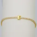Gold-plated tennis bracelet featuring a cute balloon letter E charm with sparkling cubic zirconia. - Letter E (DB260303-E)