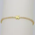 Gold tennis bracelet featuring a cute bubble letter K charm and sparkly cubic zirconia stones. - Letter K (DB260303-K)