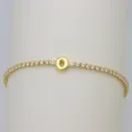 Close-up detail of gold tennis bracelet with bubble letter O charm and sparkling cubic zirconia. - Letter O (DB260303-O)