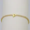 Close-up detail of the gold tennis bracelet featuring a sparkling letter P zircon charm. - Letter P (DB260303-P)