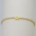 Gold tennis bracelet with sparkling cubic zirconia stones and a cute puffy letter R pendant. - Letter R (DB260303-R)