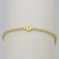 Gold tennis bracelet featuring a cute bubble letter U pendant sparkling with cubic zirconia stones. - Letter U (DB260303-U)