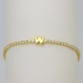 Close-up of gold initial W tennis bracelet featuring sparkling clear cubic zirconia stones. - Letter W (DB260303-W)