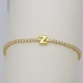 Close-up of a gold-plated tennis bracelet with a bubble letter Z and clear cubic zirconia stones. - Letter Z (DB260303-Z)