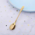Kreativer goldener Edelstahllöffel mit elegantem Federgriff für wunderbare Dessertzeiten. - 304 Titan-Gold Flügellöffel / Gold
