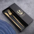 Luxury gold stainless steel cutlery set with black gift box, elegant knife and fork for kitchen table. - Titanium Gold Cutlery Set in Color Box