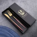 Stainless steel cutlery set with pink handle and gold finish, luxury gift box packaging for dining. - Pink & Gold Knife & Fork Set in Color Box