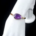Natural amethyst gemstone bracelet with irregular cut and gold bezel set on adjustable rope. - Purple Crystal