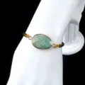 Natural green stone adjustable bracelet with gold bezel and brown braided cord for women. - Amazonite