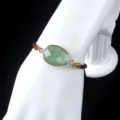 Green gemstone bezel set bracelet with adjustable brown cord, elegant daily wrist jewelry. - Green Strawberry Quartz