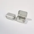 Mini rechthoekige scharnierende blikken doos voor sieraden, draagbare zilveren metalen container. - 58x40x25mm Zilver