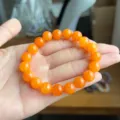 Prachtige oranje edelsteen kralen armband detail, elegante minimalistische stijl. - 8mm / Oranjegeel