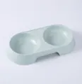 Detail view of the macaron color plastic pet double bowl, ideal for feeding cats and dogs safely. - Blue